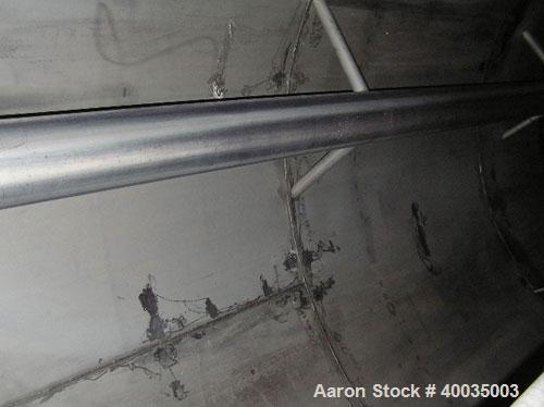 Used: Hammond Iron Works Tank, 15,000 gallon, 316 stainless steel, 11' diameter x 21' high, vertical.  Cone top and flat bottom. Insulated.  This tank has an API rating for outside storage.  MFRS. A....