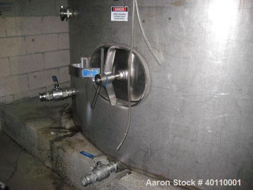 Used: Westeel 17,196 Gallon (65,000 Liter) 304 Stainless Steel Storage Tank. Vertical Design. Approx. 10' Diameter x 31'6"  Long. Slight Cone Top and Sloping Bottom having a 4-1/2" Pitch. Top head ha...