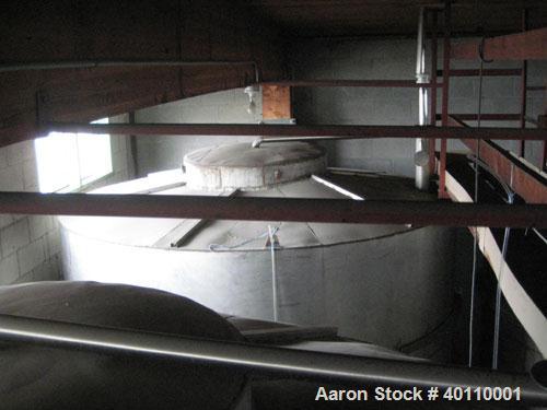 Used: Westeel 17,196 Gallon (65,000 Liter) 304 Stainless Steel Storage Tank. Vertical Design. Approx. 10' Diameter x 31'6"  Long. Slight Cone Top and Sloping Bottom having a 4-1/2" Pitch. Top head ha...