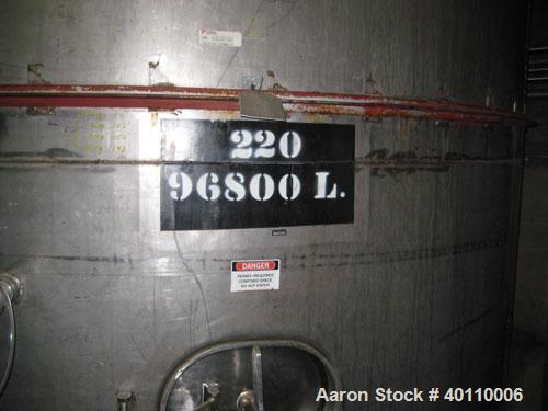 Used Westeel 25,608 Gallon (96,800 Liter) 304 Stainless Steel Storage Tank. Vertical Design. Approx. 12' Diameter x 31'6"  Long. Slight Cone Top and Sloping Bottom having a 4 1/2" Pitch. Top head has...