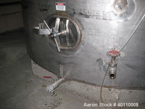 Used Westeel 25,608 Gallon (96,800 Liter) 304 Stainless Steel Storage Tank. Vertical Design. Approx. 12' Diameter x 31'6"  Long. Slight Cone Top and Sloping Bottom having a 4 1/2" Pitch. Top head has...