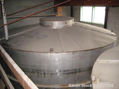 Used Westeel 25,608 Gallon (96,800 Liter) 304 Stainless Steel Storage Tank. Vertical Design. Approx. 12' Diameter x 31'6"  Long. Slight Cone Top and Sloping Bottom having a 4 1/2" Pitch. Top head has...