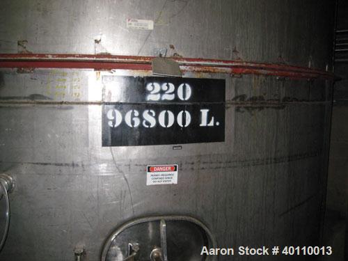Used Westeel 25,608 Gallon (96,800 Liter) 304 Stainless Steel Storage Tank. Vertical Design. Approx. 12' Diameter x 31'6"  Long. Slight Cone Top and Sloping Bottom having a 4 1/2" Pitch. Top head has...