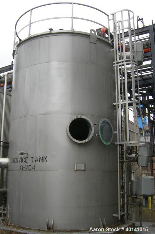 Used: Steel tank and Fabricators tank, 15,000 gallon, 316 L. 1/4" shellL, 12' diameter X 17'6" high, flat top and bottom,  vertical, API standard 650 rating. Top mounted Lightnin agitator, model 15S2...