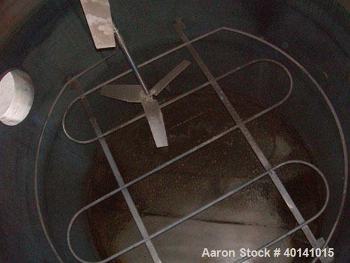 Used: Steel tank and Fabricators tank, 15,000 gallon, 316 L. 1/4" shellL, 12' diameter X 17'6" high, flat top and bottom,  vertical, API standard 650 rating. Top mounted Lightnin agitator, model 15S2...