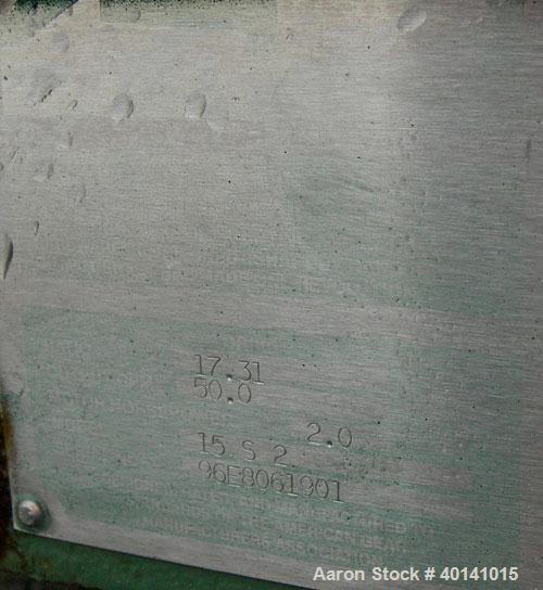Used: Steel tank and Fabricators tank, 15,000 gallon, 316 L. 1/4" shellL, 12' diameter X 17'6" high, flat top and bottom,  vertical, API standard 650 rating. Top mounted Lightnin agitator, model 15S2...