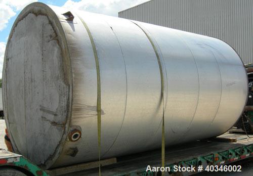 Used Industrial Air Inc Tank, 7,000 gallon, 304 stainless steel, vertical. Approximately 104" diameter x 192" straight side. Flat top and bottom. Carbon steel agitator bridge with an off center top e...
