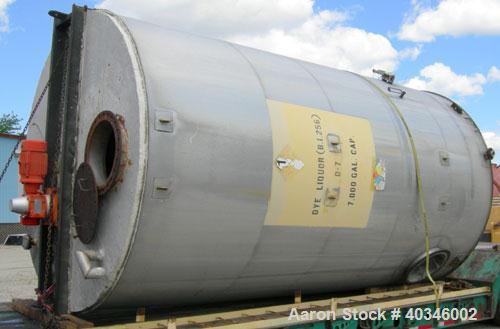 Used Industrial Air Inc Tank, 7,000 gallon, 304 stainless steel, vertical. Approximately 104" diameter x 192" straight side. Flat top and bottom. Carbon steel agitator bridge with an off center top e...