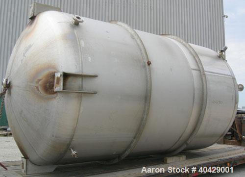 Used Northland Stainless pressure tank, 6500 gallon, 316 stainless steel, vertical. 107 3/8" diameter x 13' straight side, dished top and bottom. Internal rated FV and 40 psi at 200 deg F. Openings: ...