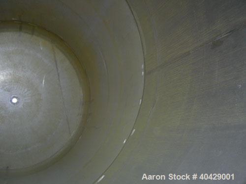Used Northland Stainless pressure tank, 6500 gallon, 316 stainless steel, vertical. 107 3/8" diameter x 13' straight side, dished top and bottom. Internal rated FV and 40 psi at 200 deg F. Openings: ...