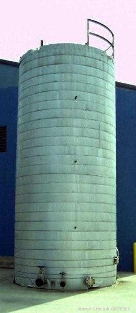 Used 15,000 Gallon insulated stainless steel tank. 3/8" thick 304 stainless steel, 34' tall, 10'6" diameter, multiple fill and discharge ports, access hatch, electrically heated.