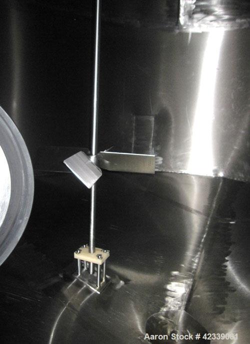 Used Tank, JV Northwest, 6,400 Gallon, stainless steel, 9' 3" diameter x 12' high.  Vertical, slight cone top and bottom.  Top mounted Burhans-Sharpe 1 hp agitator drive connected to a stainless stee...