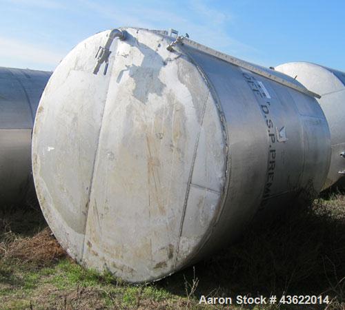 Used Saracco Tank & Mfg Approximately 5,200 Gallon Stainless Steel Storage Tank. Approximately 9' diameter x 11' straight side. Flat bottom and slight cone top. Various top openings including a 17" m...
