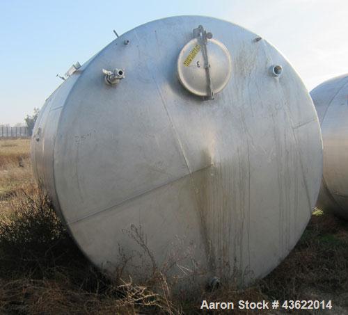 Used Saracco Tank & Mfg Approximately 5,200 Gallon Stainless Steel Storage Tank. Approximately 9' diameter x 11' straight side. Flat bottom and slight cone top. Various top openings including a 17" m...