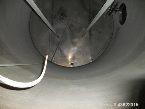 Used Krenz Approximately 5,200 Gallon Stainless Steel Storage Tank. Approximately 9' diameter x 11' straight side. Flat bottom and slight cone top. Various top openings including a 17" manway with co...
