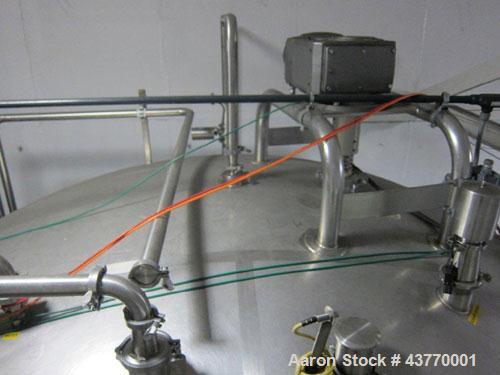 Used 6000 gallon SS Single Shell Dome Top & Bottom Vertical Tank; 112" diameter x 132" straight side; with vertical agitator, baffle and spray ball; Seismic zone rated legs; Tank #5A.