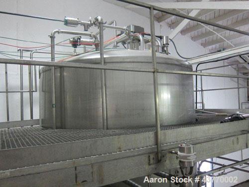 Used 6000 gallon SS Single Shell Dome Top & Bottom Vertical Tank; 112" x 132"; with vertical agitatior, baffle and spray ball; Seismic zone rated legs; Tank #5B.