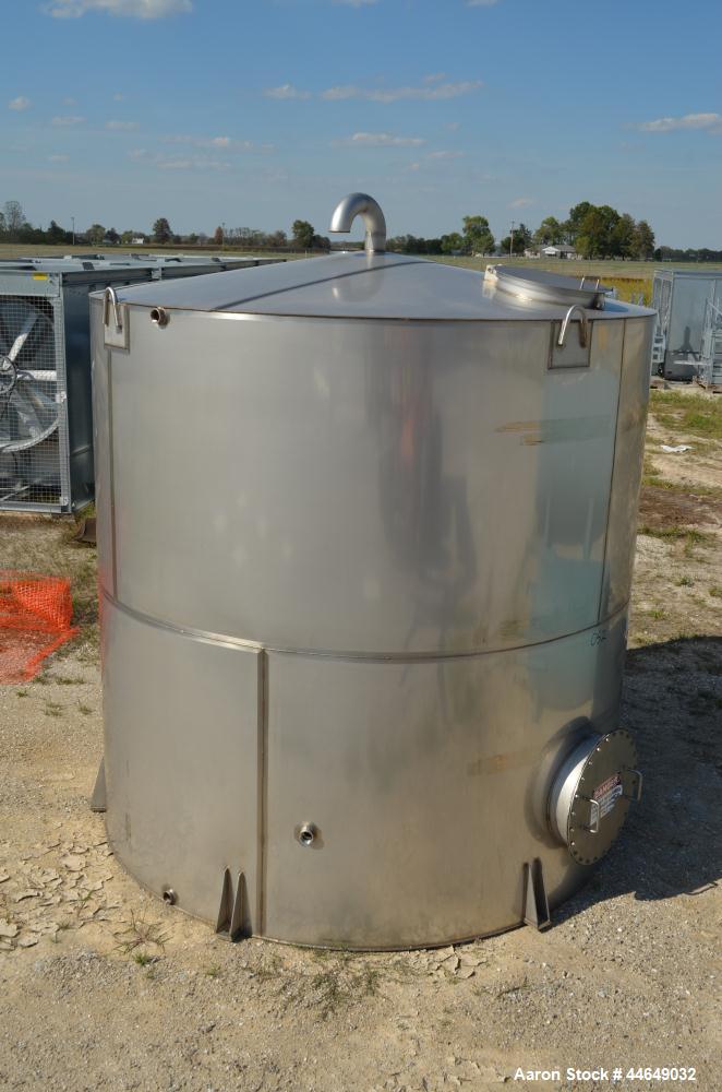 Unused- 5800 Gallon Storage Tank, stainless steel. Approximate 120" diameter x 120" straight side, coned top, flat bottom. Side, and top manways with covers. No manufacturers tag.