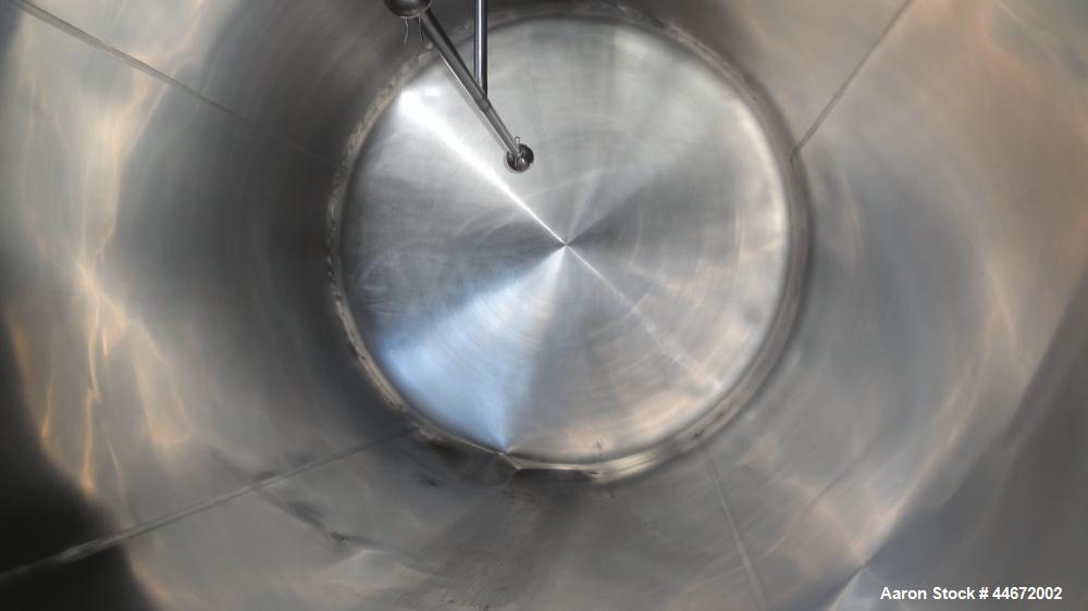 Used Storage Tank, 5000 Gallon, 304 Stainless Steel, Horizontal. Approximate 96" diameter x 144" straight side, dished heads. Insulated with carbon steel sheathing. (2) Spray balls. 16" x 20" Oval ma...