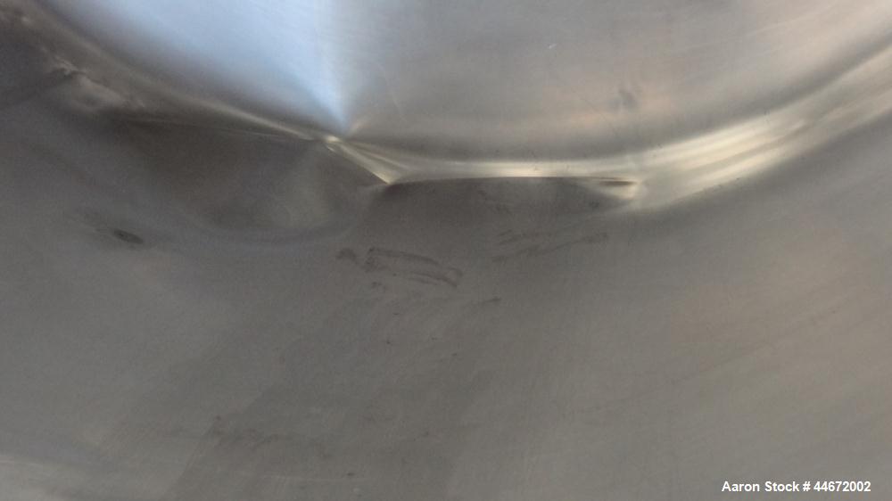 Used Storage Tank, 5000 Gallon, 304 Stainless Steel, Horizontal. Approximate 96" diameter x 144" straight side, dished heads. Insulated with carbon steel sheathing. (2) Spray balls. 16" x 20" Oval ma...