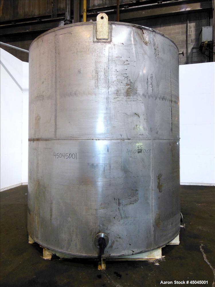 Used Tank, 5,000 Gallon, 304 Stainless Steel, Vertical. Approximate 112" x 120" straight side, slight coned top, flat bottom. Openings top (2) 3", side 3", 17" x 20" oval man way with cover, 3" side ...