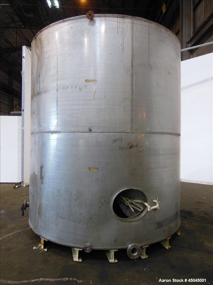 Used Tank, 5,000 Gallon, 304 Stainless Steel, Vertical. Approximate 112" x 120" straight side, slight coned top, flat bottom. Openings top (2) 3", side 3", 17" x 20" oval man way with cover, 3" side ...