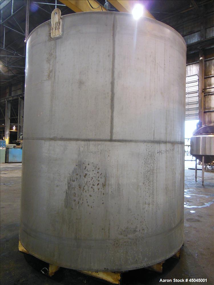 Used Tank, 5,000 Gallon, 304 Stainless Steel, Vertical. Approximate 112" x 120" straight side, slight coned top, flat bottom. Openings top (2) 3", side 3", 17" x 20" oval man way with cover, 3" side ...