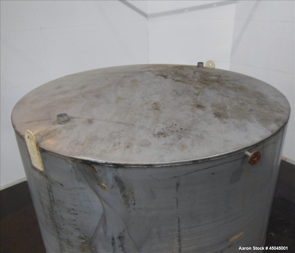 Used Tank, 5,000 Gallon, 304 Stainless Steel, Vertical. Approximate 112" x 120" straight side, slight coned top, flat bottom. Openings top (2) 3", side 3", 17" x 20" oval man way with cover, 3" side ...