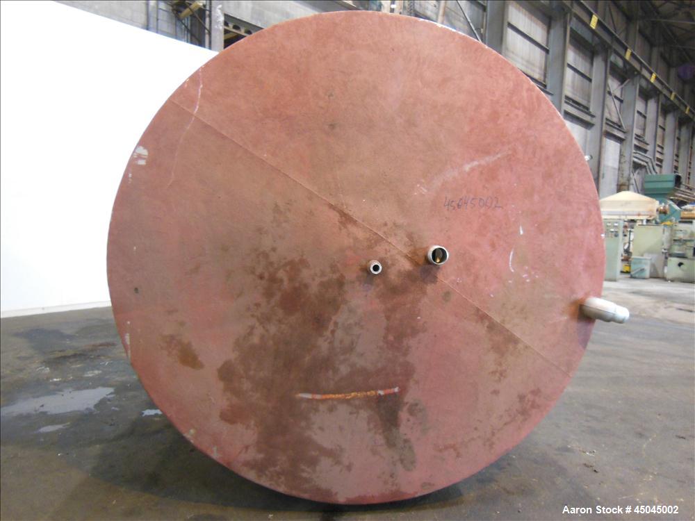 Used Tank, 5,000 Gallon, 304 Stainless Steel, Vertical. Approximate 102" x 142" straight side, slight coned top, sloped bottom. Openings top 3", 3-1/2", 1-1/2", side 16" x 20" oval man way with cover...