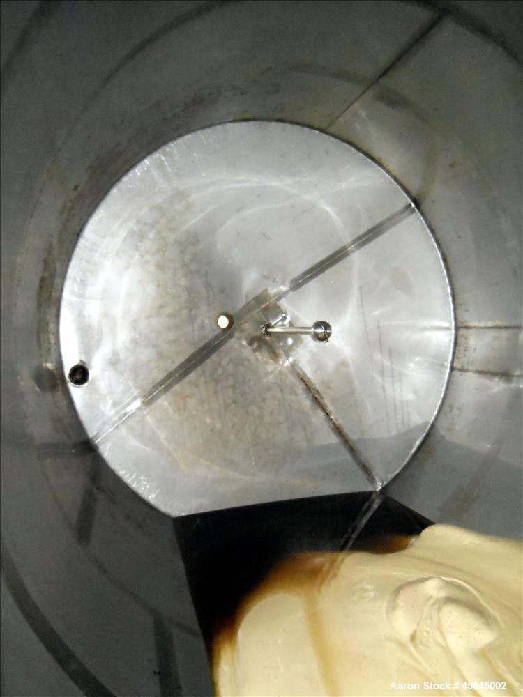 Used Tank, 5,000 Gallon, 304 Stainless Steel, Vertical. Approximate 102" x 142" straight side, slight coned top, sloped bottom. Openings top 3", 3-1/2", 1-1/2", side 16" x 20" oval man way with cover...