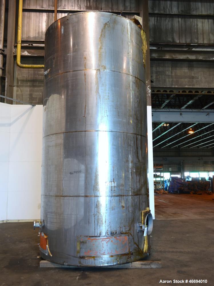 Used Tank, Approximate 6000 Gallon, 304 Stainless Steel, Vertical. Approximate 96" diameter x 192" straight side, coned top, inverted dished bottom. Openings side 16" x 20" oval man way with cover, 3...