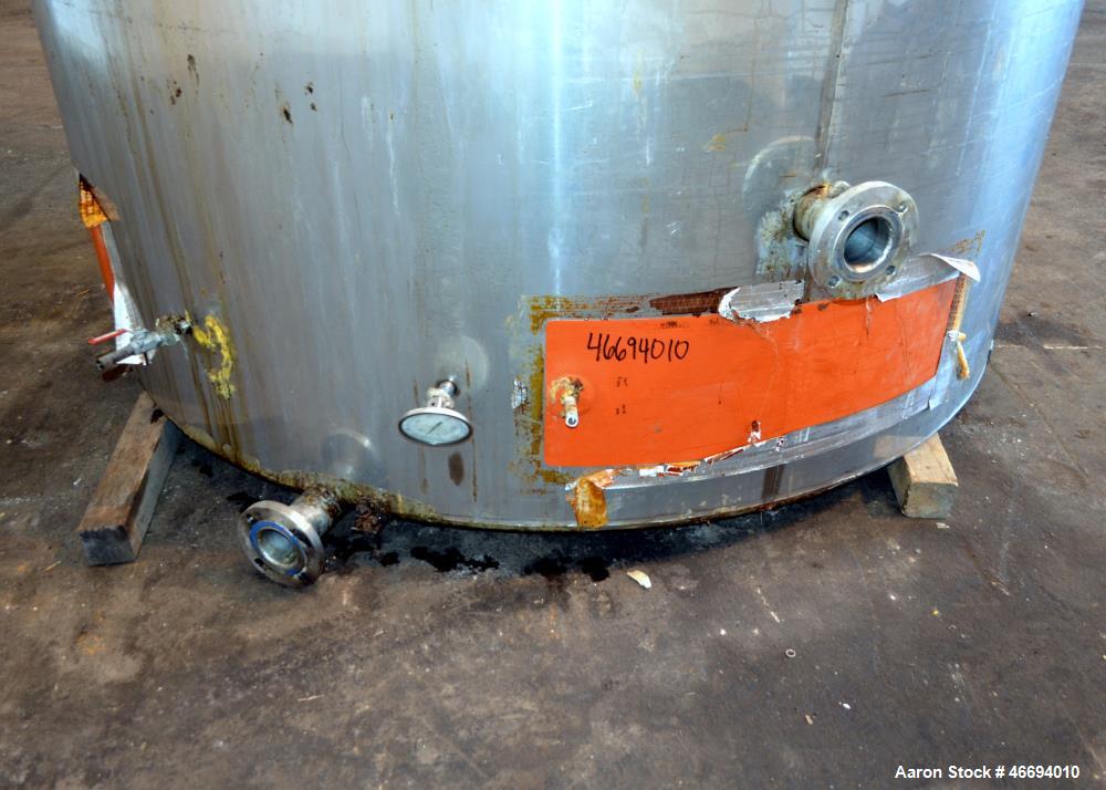 Used Tank, Approximate 6000 Gallon, 304 Stainless Steel, Vertical. Approximate 96" diameter x 192" straight side, coned top, inverted dished bottom. Openings side 16" x 20" oval man way with cover, 3...
