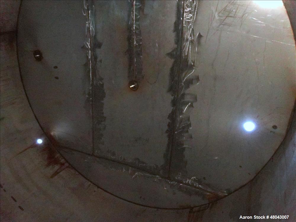 Used Storage Tank, Approximate 8,400 Gallon, 304 Stainless Steel, Vertical.
