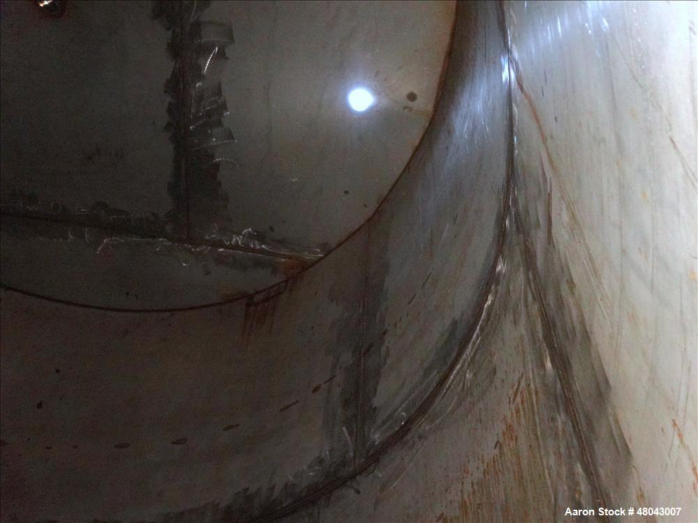 Used Storage Tank, Approximate 8,400 Gallon, 304 Stainless Steel, Vertical.