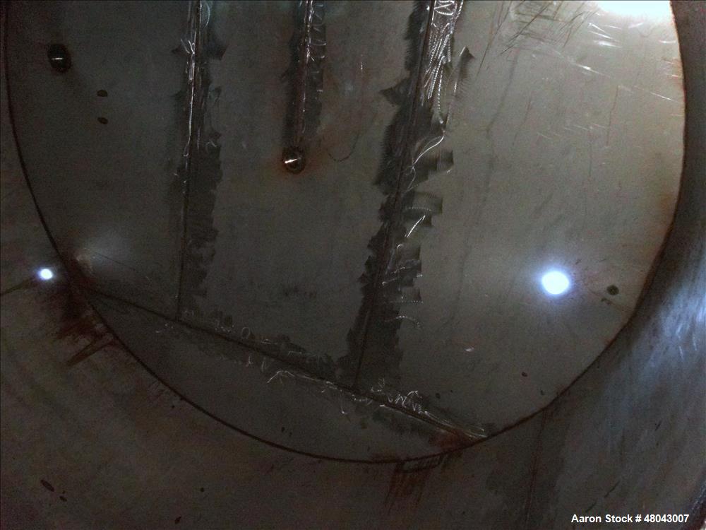 Used Storage Tank, Approximate 8,400 Gallon, 304 Stainless Steel, Vertical.