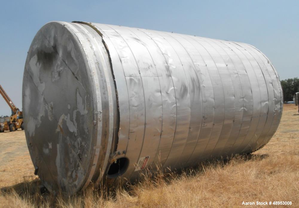 Used Tank, 17,000 Gallon, Stainless Steel, Vertical. Approximate 12' diameter x 20' straight side. Includes cone top with slight sloped bottom to 3" diameter side bottom outlet, 16" x 20" oval side b...