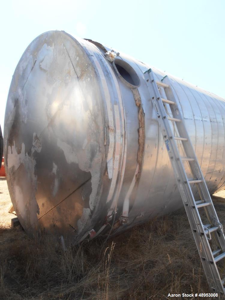 Used Tank, 17,000 Gallon, Stainless Steel, Vertical. Approximate 12' diameter x 20' straight side. Includes cone top with slight sloped bottom to 3" diameter side bottom outlet, 16" x 20" oval side b...