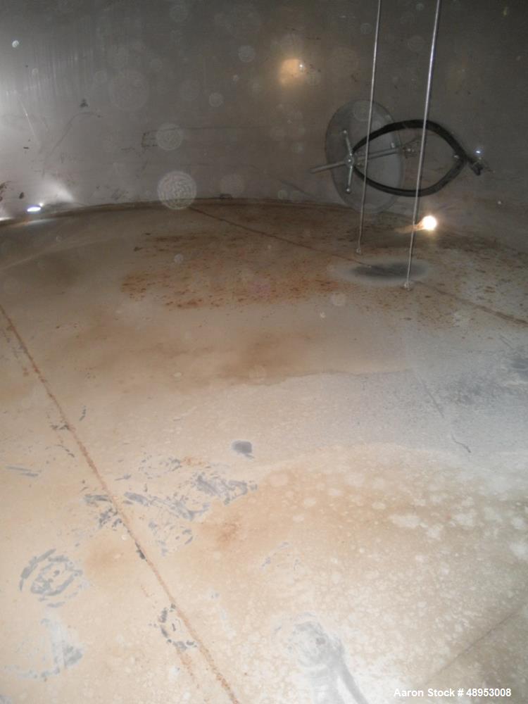 Used Tank, 17,000 Gallon, Stainless Steel, Vertical. Approximate 12' diameter x 20' straight side. Includes cone top with slight sloped bottom to 3" diameter side bottom outlet, 16" x 20" oval side b...
