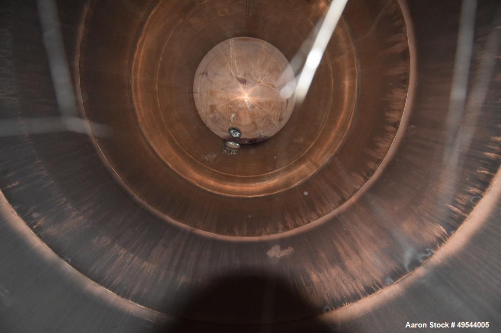 Used Tank, Approximate 19,500 Gallon, 14 Gauge Stainless steel, Vertical. Approximate 130” diameter x 336” straight side, coned top, 7” sloped bottom. Openings top 16” man way with cover and approxim...