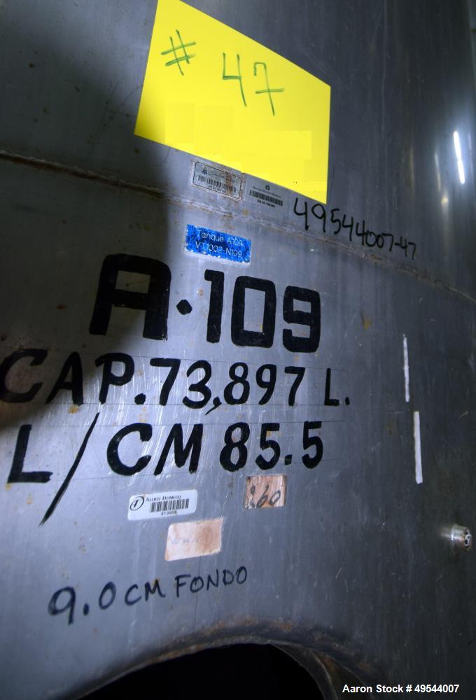 Used Tank, Approximate 19,500 Gallon, 14 Gauge Stainless steel, Vertical. Approximate 130” diameter x 336” straight side, coned top, 7” sloped bottom. Openings top 16” man way with cover and approxim...