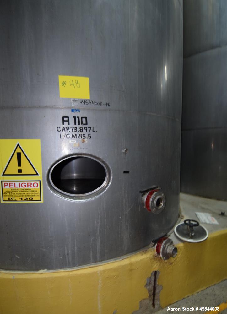 Used Tank, Approximate 19,500 Gallon, 14 Gauge Stainless steel, Vertical. Approximate 130” diameter x 336” straight side, coned top, 7” sloped bottom. Openings top 16” man way with cover and approxim...