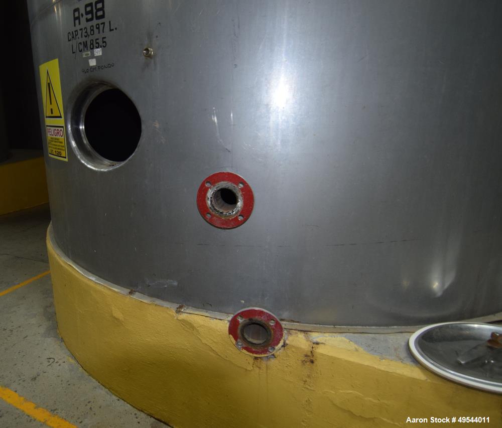 Used Tank, Approximate 19,500 Gallon, 14 Gauge Stainless steel, Vertical. Approximate 130” diameter x 336” straight side, coned top, 7” sloped bottom. Openings top 16” man way with cover and approxim...
