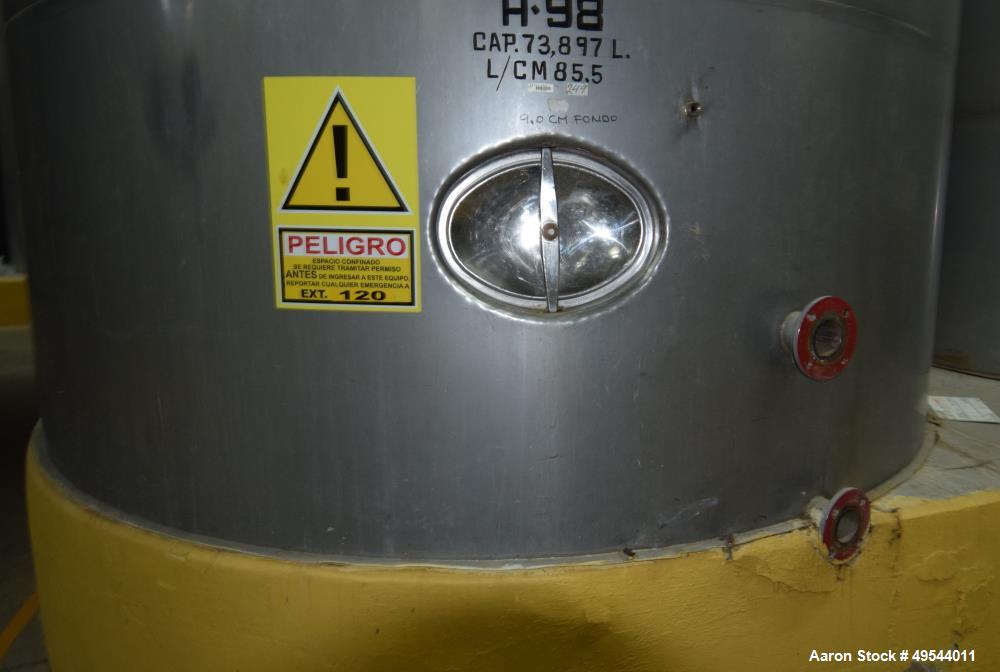 Used Tank, Approximate 19,500 Gallon, 14 Gauge Stainless steel, Vertical. Approximate 130” diameter x 336” straight side, coned top, 7” sloped bottom. Openings top 16” man way with cover and approxim...