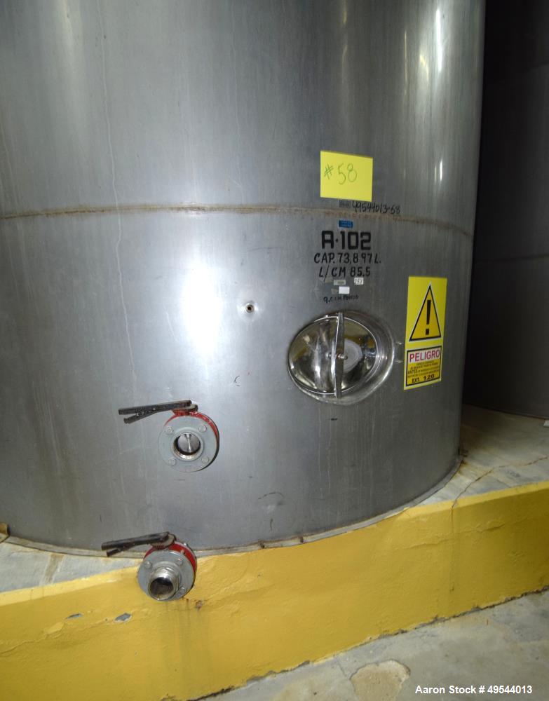 Used Tank, Approximate 19,500 Gallon, 14 Gauge Stainless steel, Vertical. Approximate 130” diameter x 336” straight side, coned top, 7” sloped bottom. Openings top 16” man way with cover and approxim...
