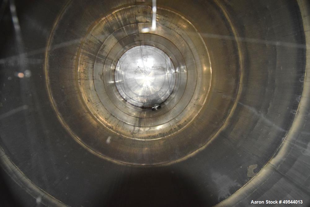 Used Tank, Approximate 19,500 Gallon, 14 Gauge Stainless steel, Vertical. Approximate 130” diameter x 336” straight side, coned top, 7” sloped bottom. Openings top 16” man way with cover and approxim...
