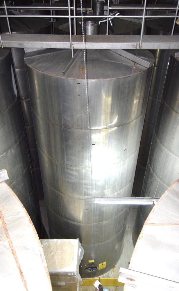 Used Tank, Approximate 19,500 Gallon, 14 Gauge Stainless steel, Vertical. Approximate 130” diameter x 336” straight side, coned top, 7” sloped bottom. Openings top 16” man way with cover and approxim...