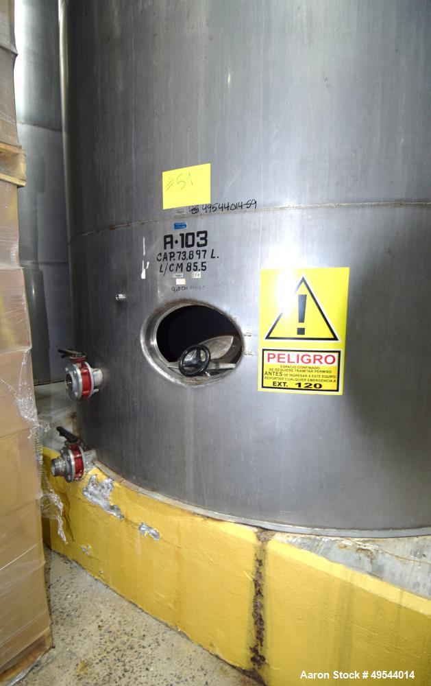 Used Tank, Approximate 19,500 Gallon, 14 Gauge Stainless steel, Vertical. Approximate 130” diameter x 336” straight side, coned top, 7” sloped bottom. Openings top 16” man way with cover and approxim...