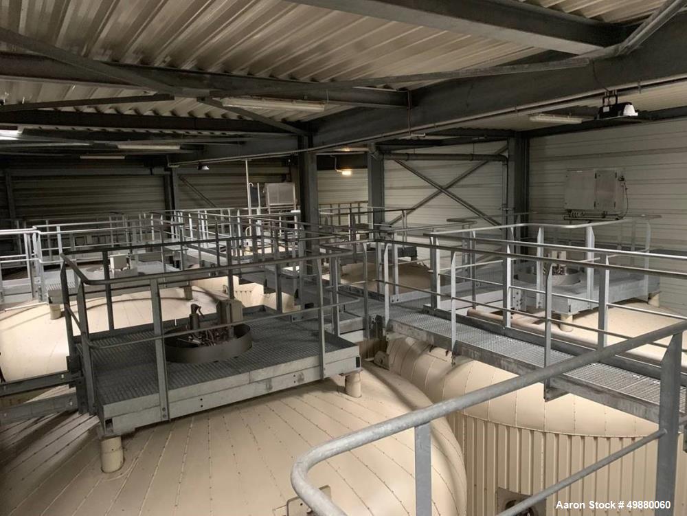 Used Holvrieka Ido BV. vertical tank. Capacity 58201 gallon/220000-liter, 304 stainless steel on product contact parts. 15.10" dia. x 5010" high (4914 mm dia. x 15680 mm high). Jacketed rated for 19....