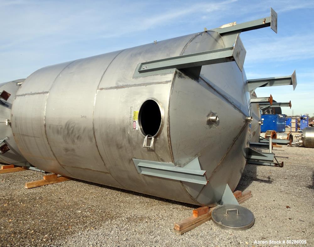 Used Tank, 8,000 Gallon, 304 Stainless Steel, Vertical. Approximate 112" diameter x 180" straight side, flat top, coned bottom. (1) Spray nozzle. Openings top (3) 2", 4", 24" man way with cover. Appr...