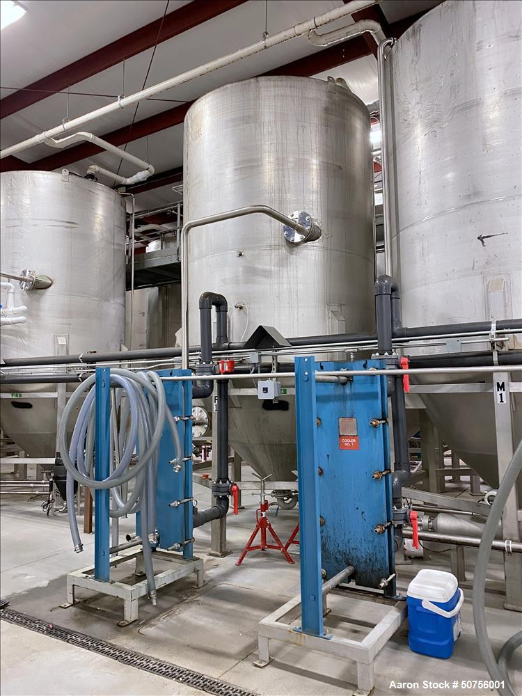 Used Vertical Tank, Approximately 5,000 Gallon, 304 Stainless Steel, 100.5" diameter, 120.5" straight side height. 64.5" conical bottom. 217" overall height. 3" center bottom discharge. The side has ...